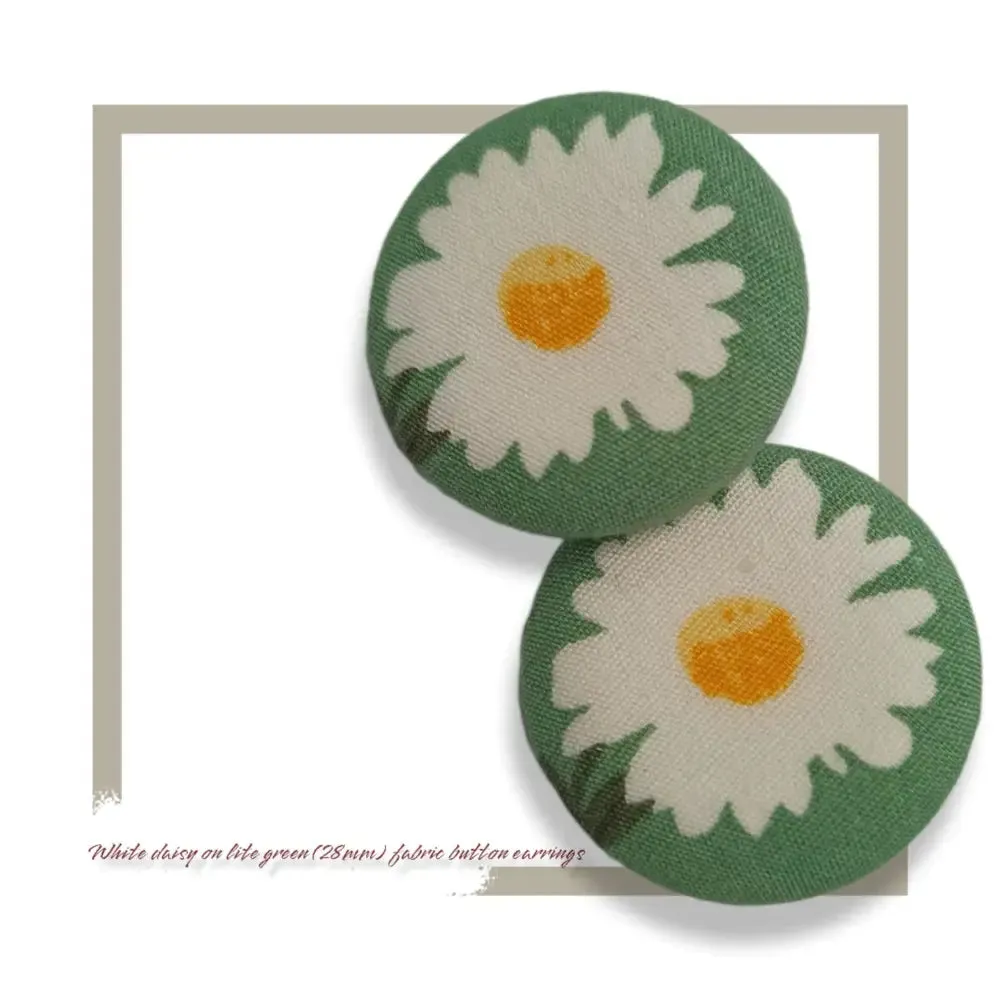 White summer daisy on light green themed fabric button earrings